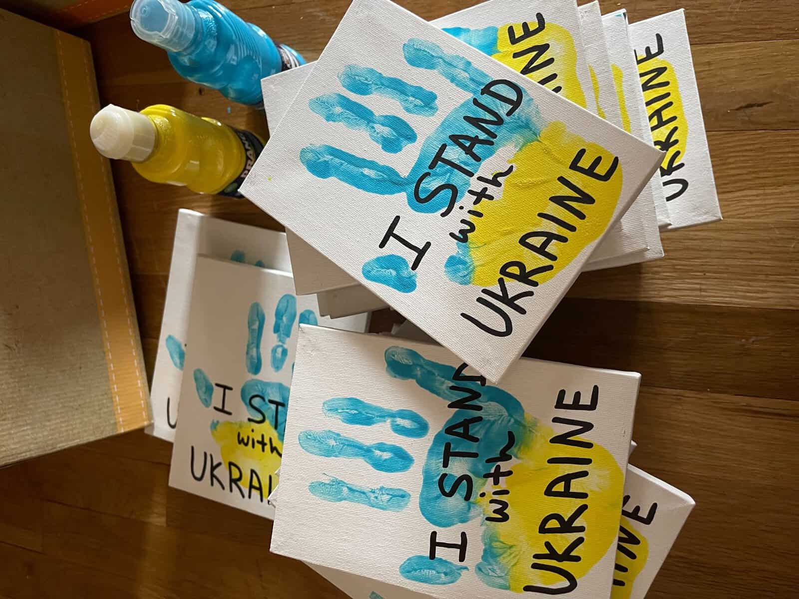 Hillsborough Elementary School student selling hand-crafted paintings in support of Ukraine