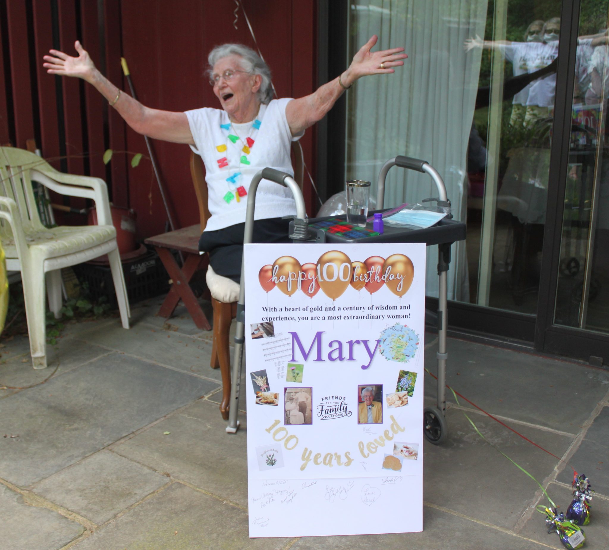 Centenarian celebrates birthday surrounded by (socially distant) family and friends