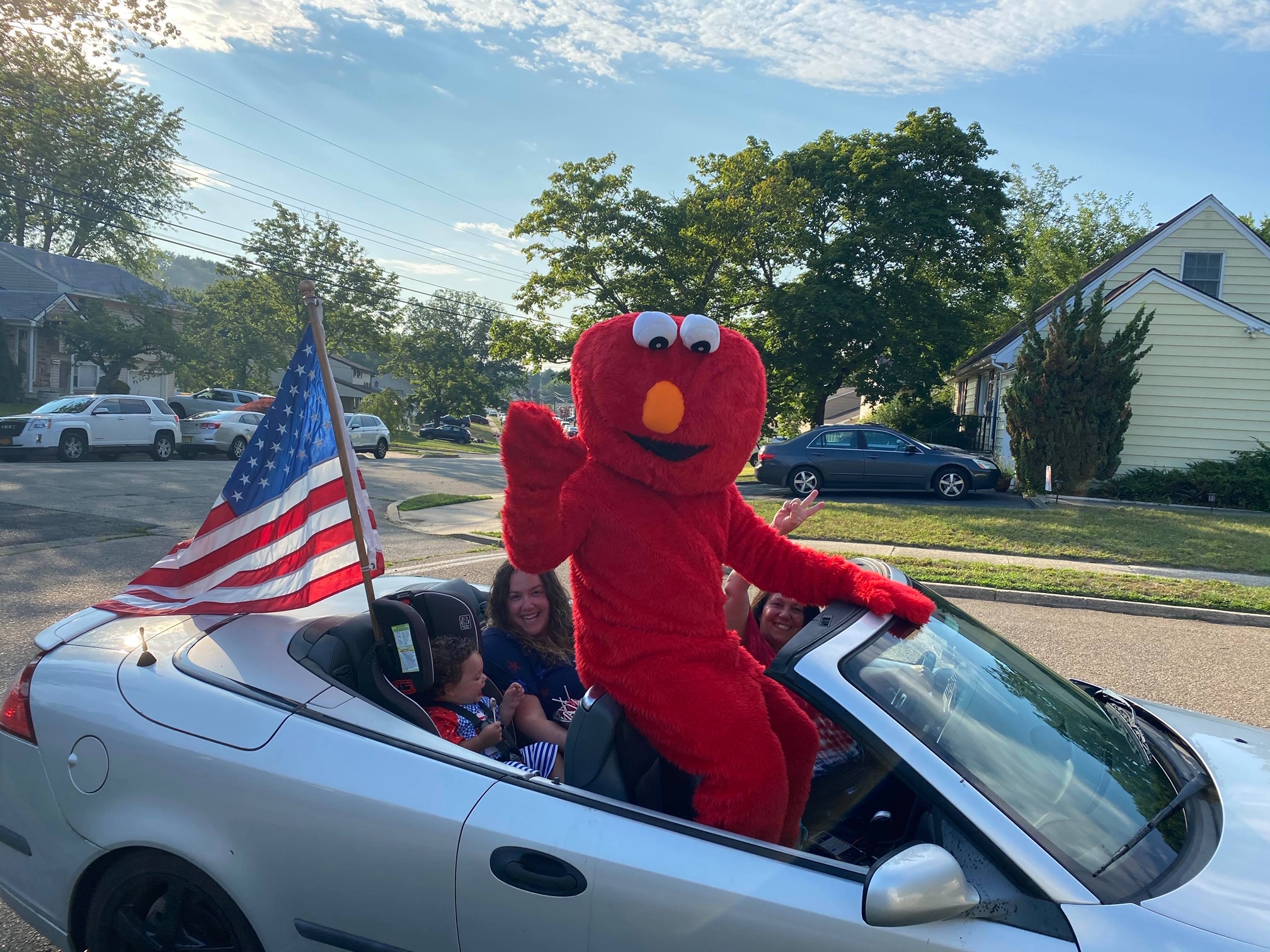 Elmo brings smiles and sweet treats to the children in Central Park development