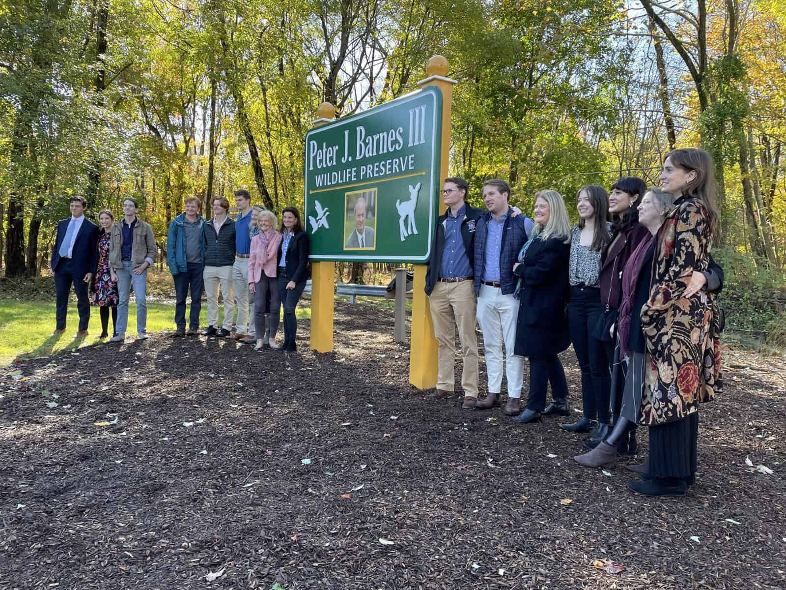 Family, friends and colleagues unveil sign for Peter J. Barnes III Wildlife Preserve