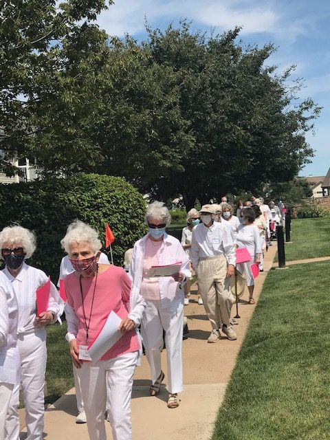 Residents of Stonebridge at Montgomery march to celebrate anniversary of women’s right to vote