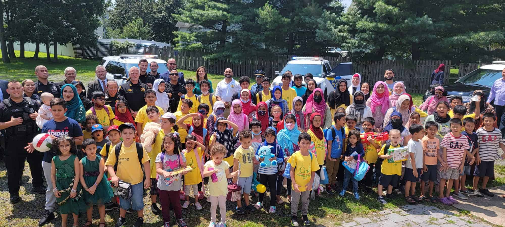 Law enforcement officers join graduating children on last day of Masjid Al-Wali summer camp