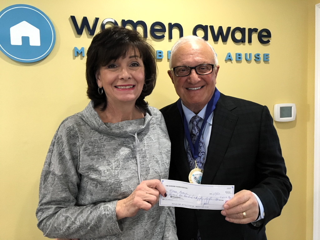 Sansone presents donation to Women Aware