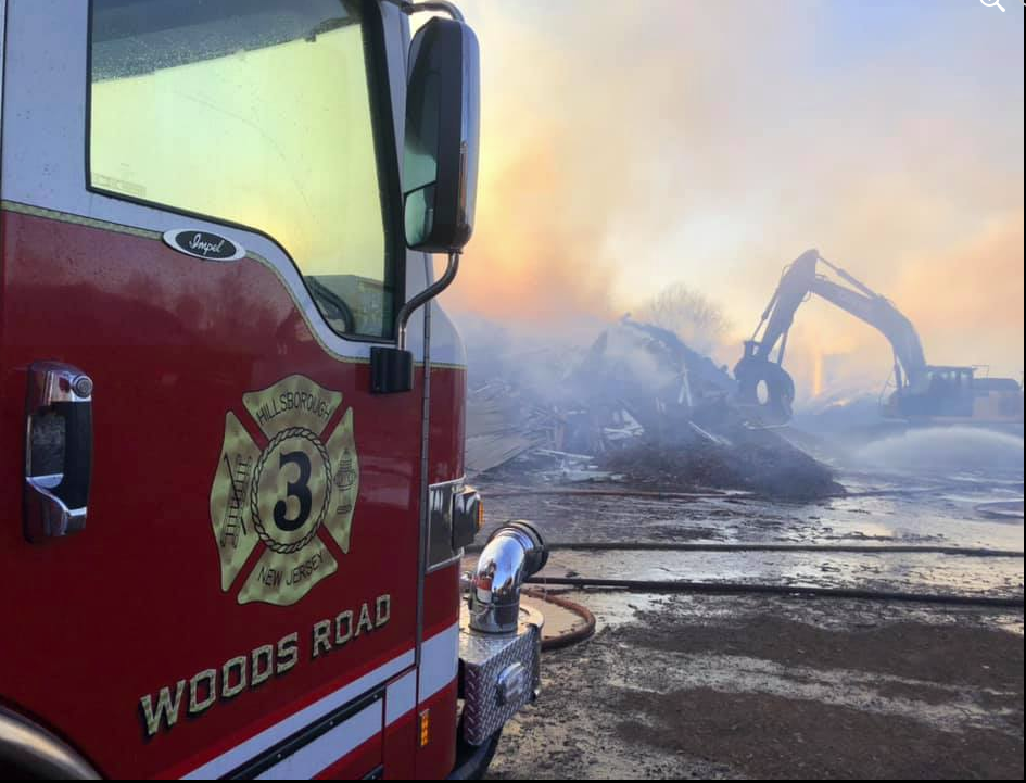 High winds spread brush fire to pole barn, causing damage