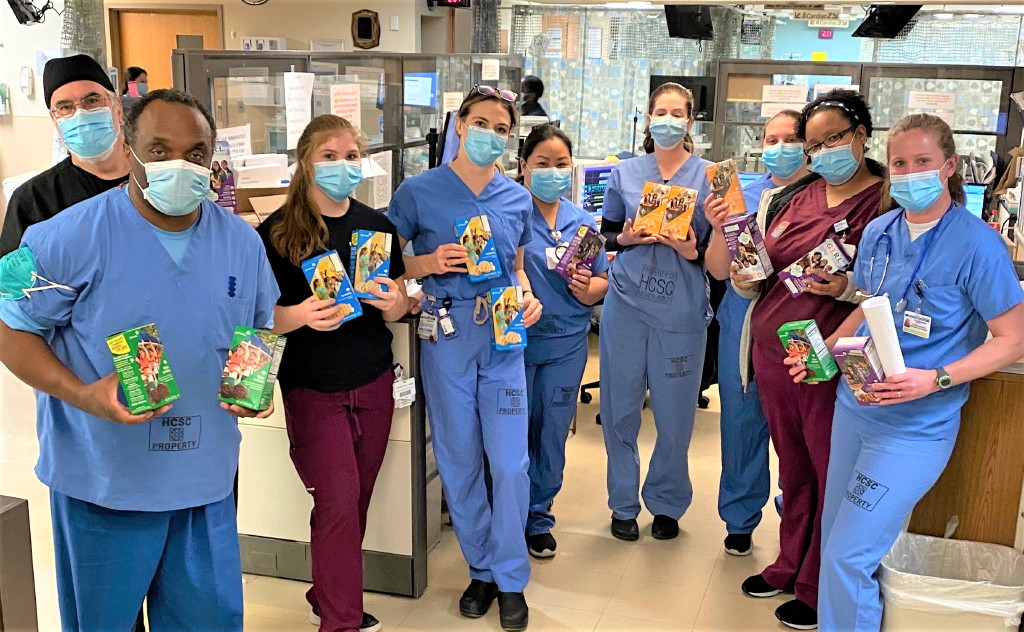 Girl Scouts deliver boxes of cookies to front-line heroes