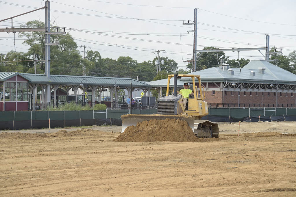 Officials come all aboard for Transit Village groundbreaking