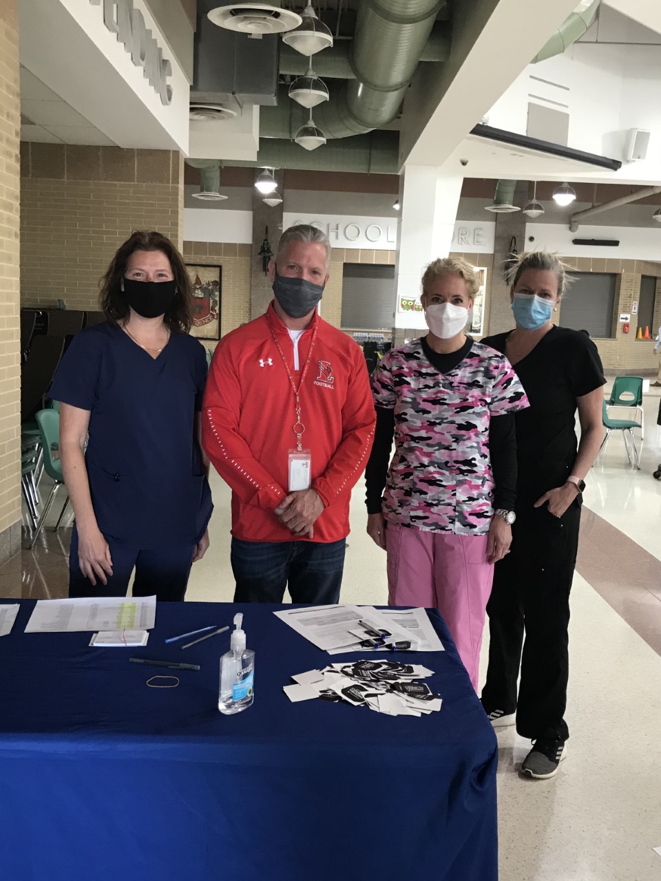 Lawrence school staffers receive COVID-19 vaccines