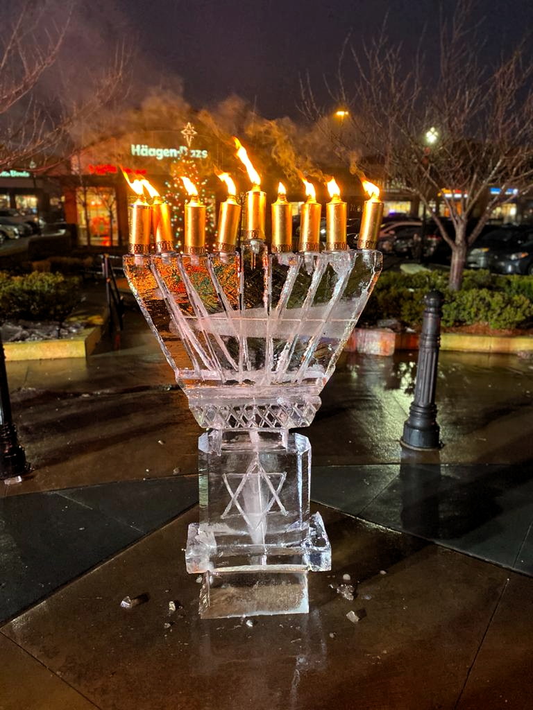 Ice menorah, parachutes filled with chocolate highlight menorah lighting in North Brunswick