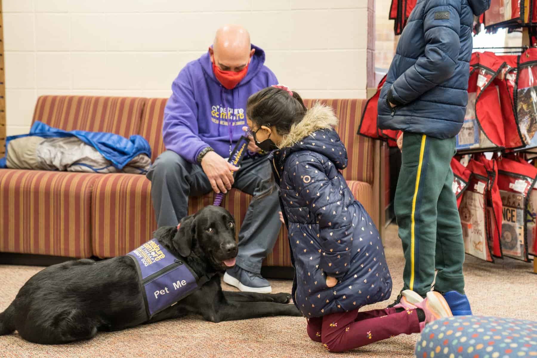 Children read to therapy dogs in judgement-free environment