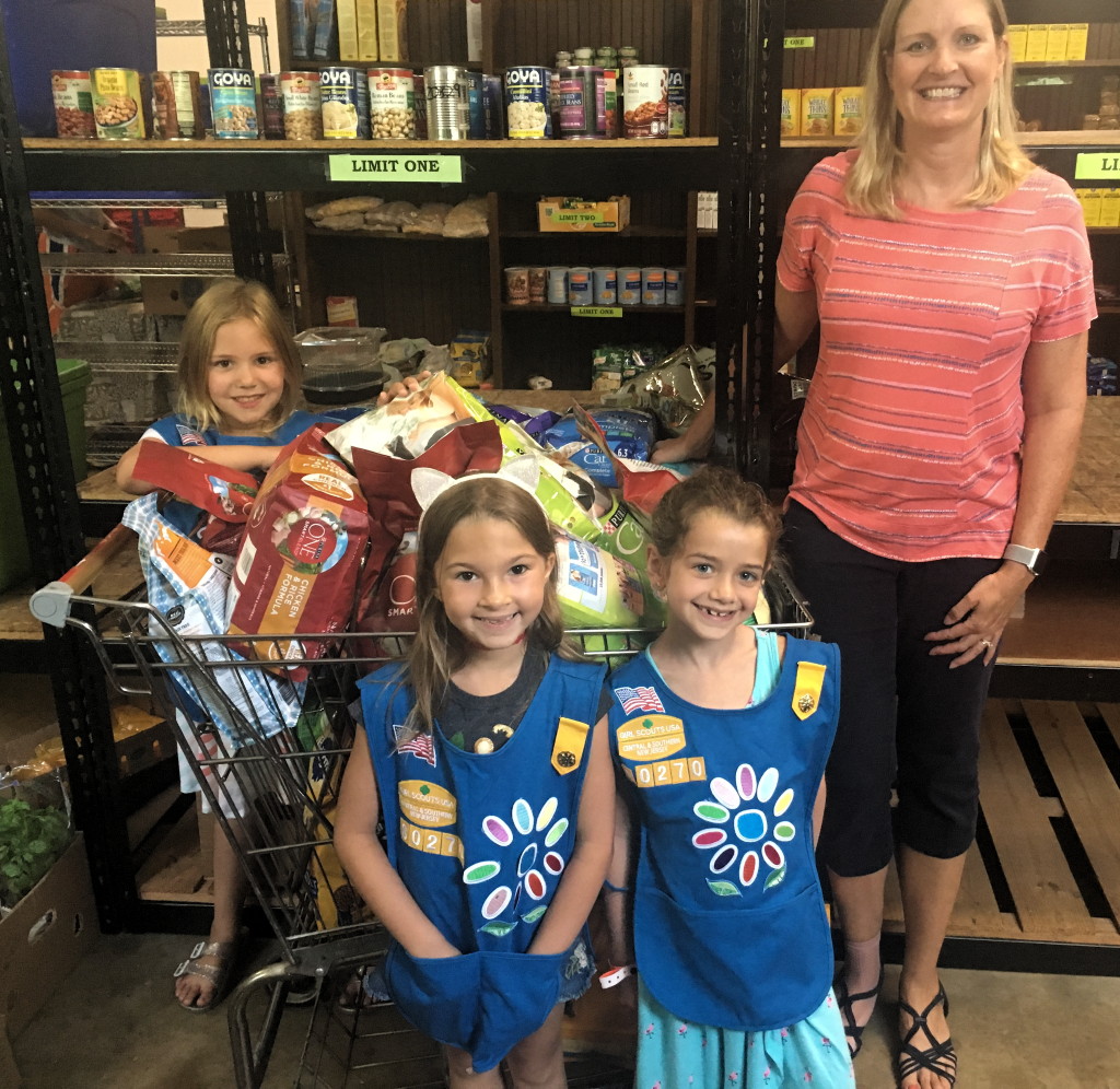 Milltown Daisy Troop 80270 donates pet food to Bentley Community Services