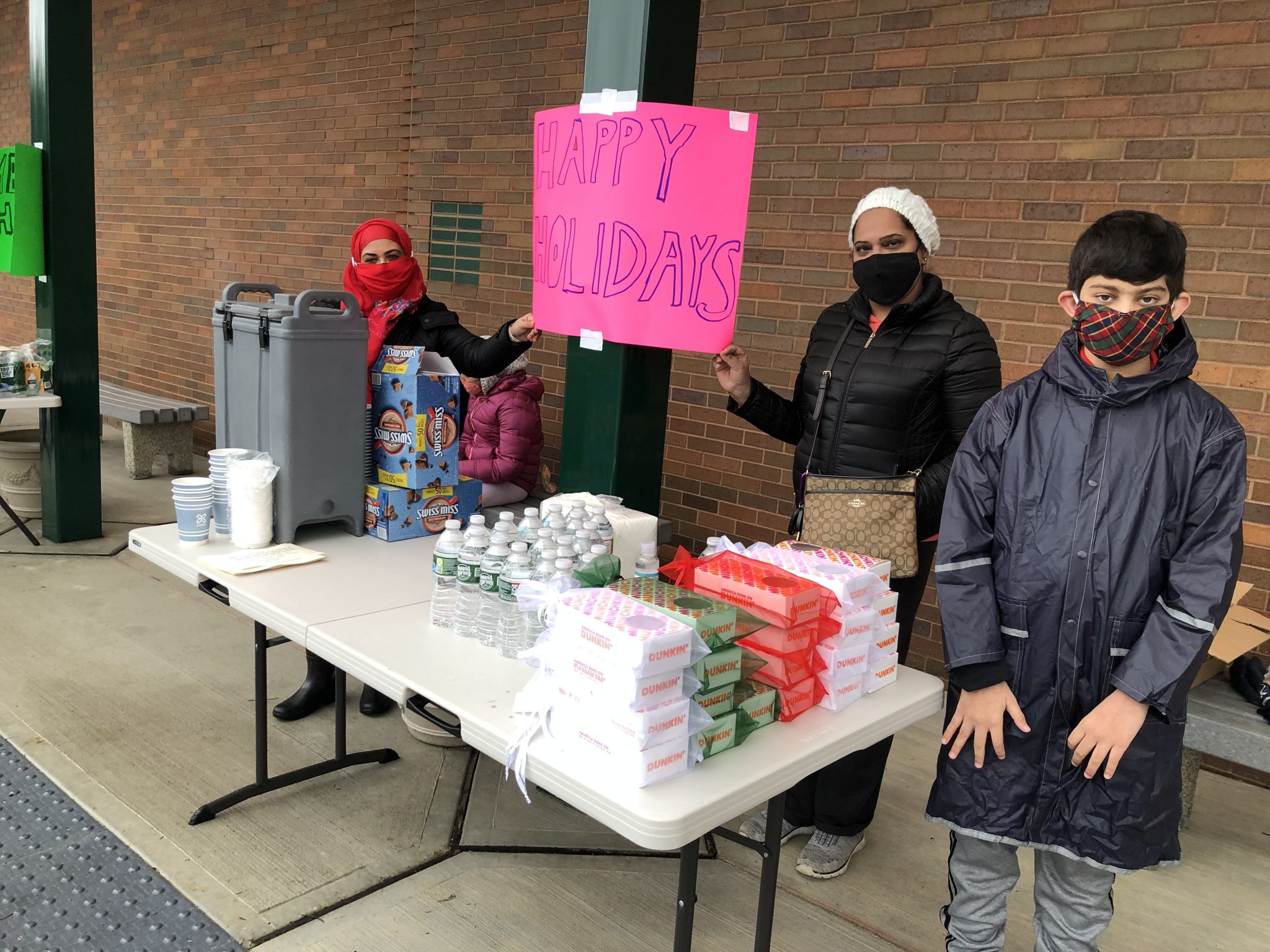 Two dozens volunteers from the Islamic Society of Central Jersey hand out food on Christmas Day