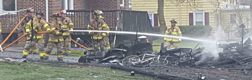 Firefighters tend to detached garage on fire