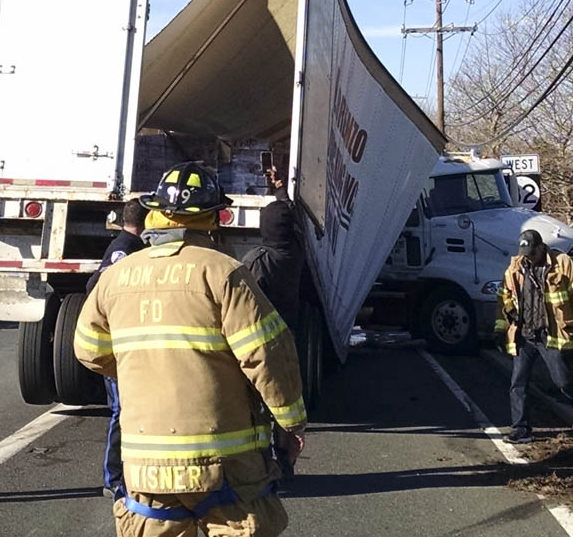 Two traffic trailers – including one carrying syrup – overturn off Exit 8A