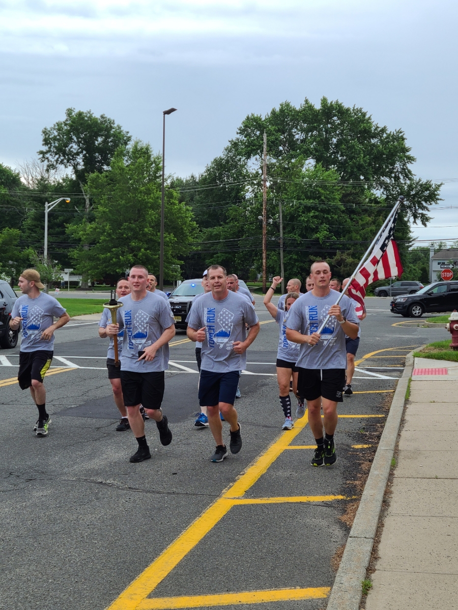 South Brunswick officers run with Life Skills students during Special Olympics Torch Run