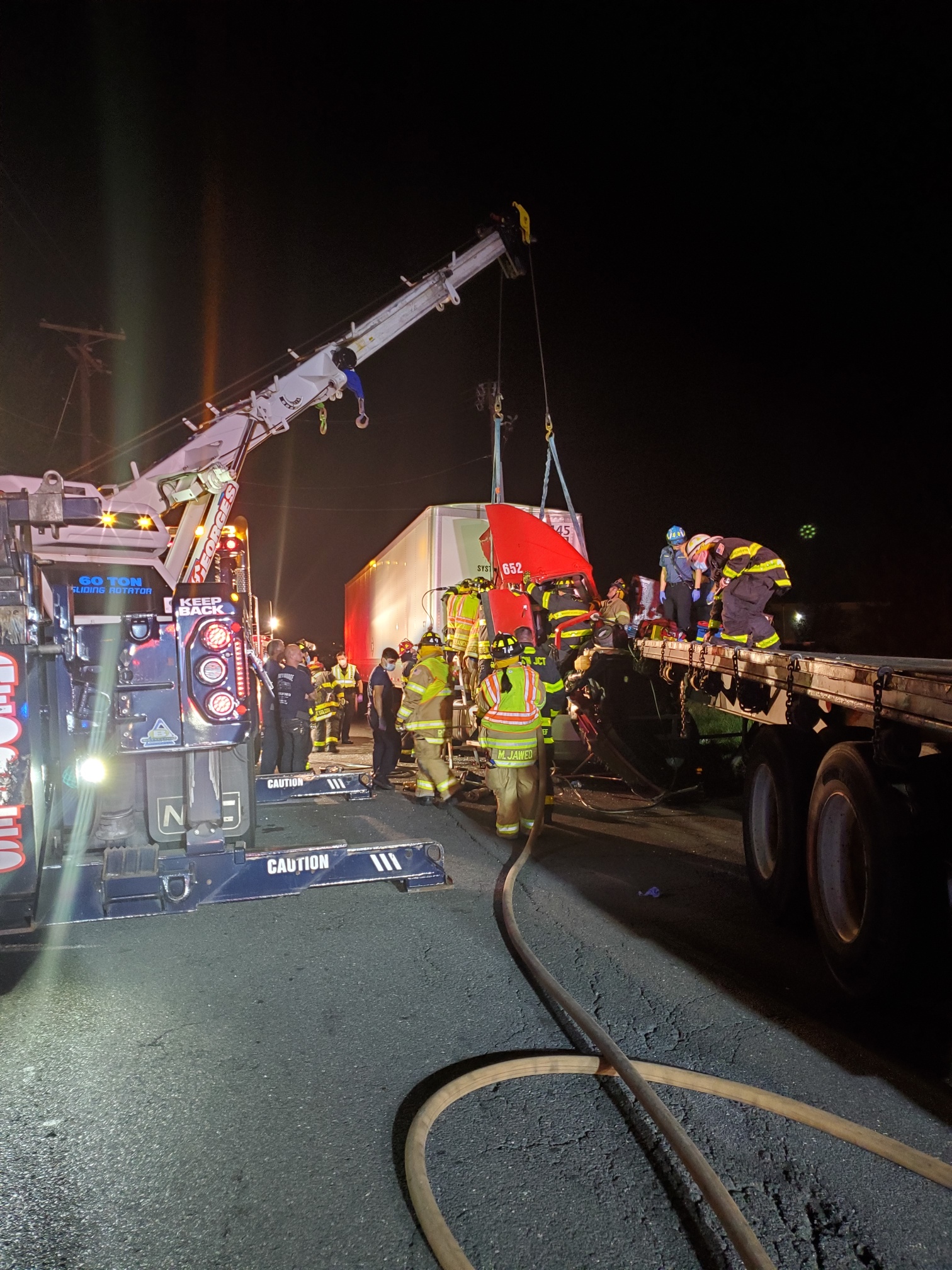 Dozen firefighters use Jaws of Life to extricate driver after tractor trailer crash; suffers fatal injuries