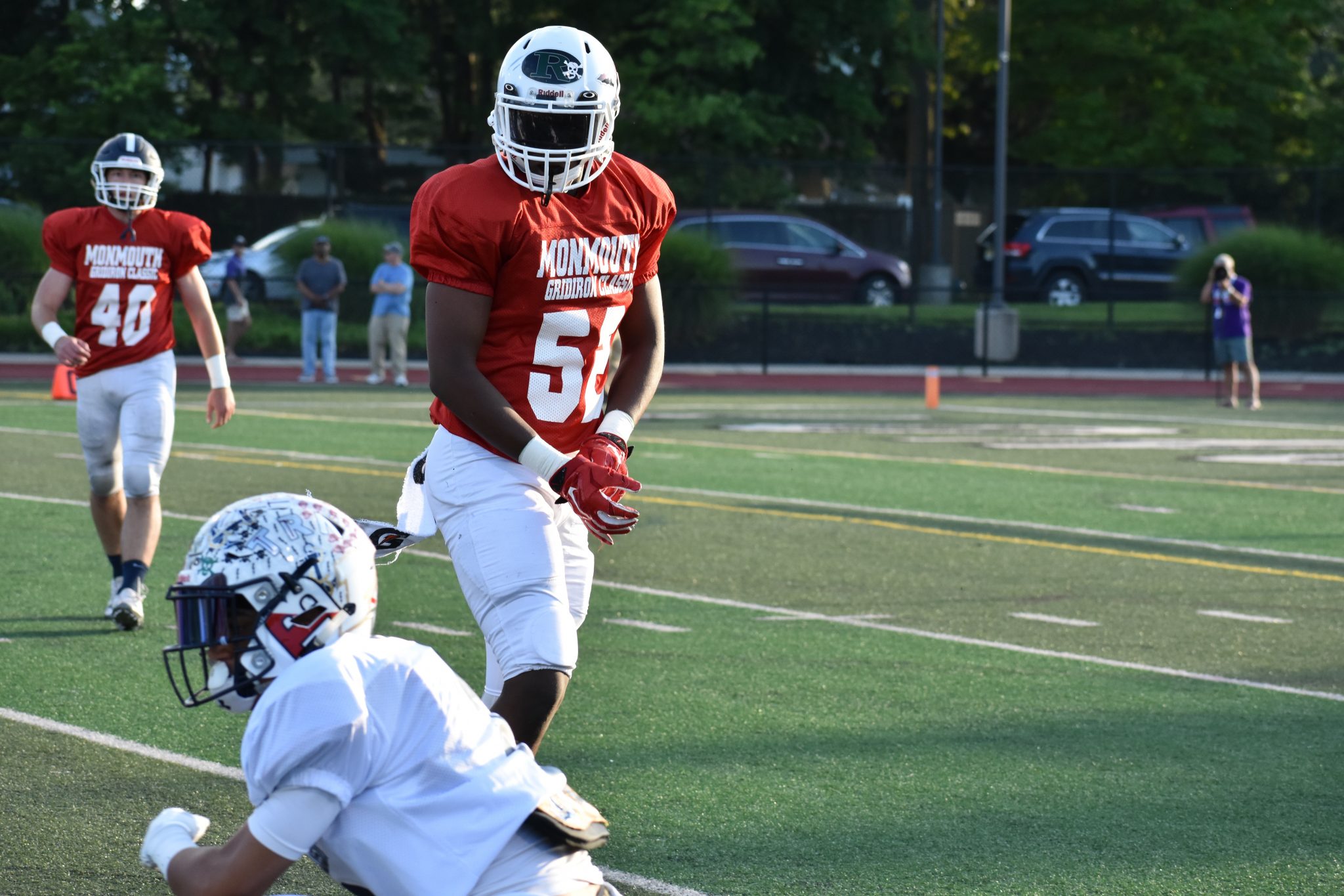 Monmouth players enjoy victory over Ocean County in Gridiron Classic