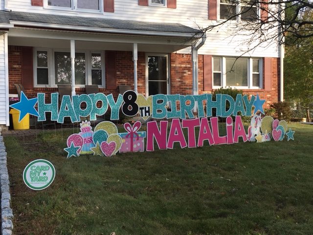 Eight-year-old celebrates birthday with giant lawn sign