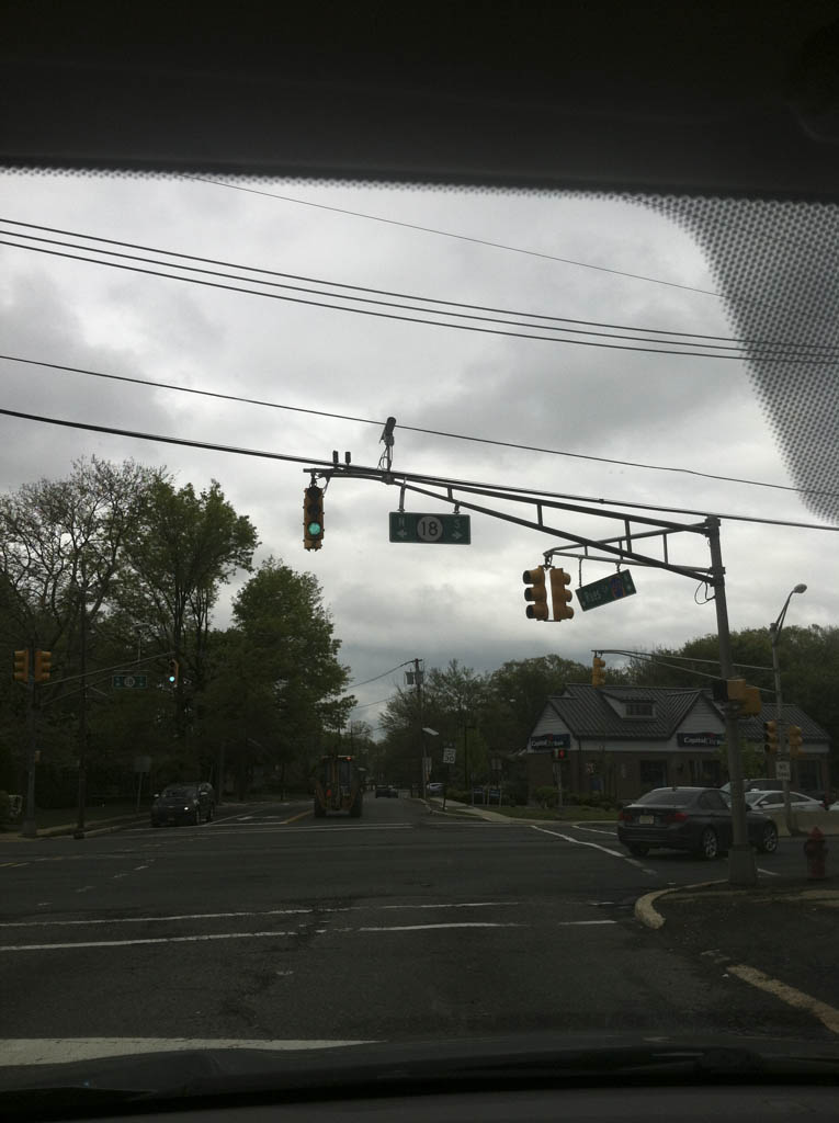 Route 18 closed at Turnpike Exit 9 due to overturned tractor-trailer