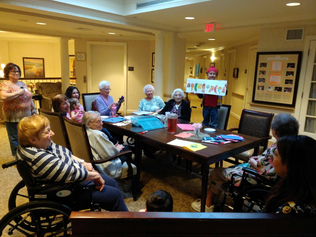 Children hold storytime for seniors at Sunrise Senior Living