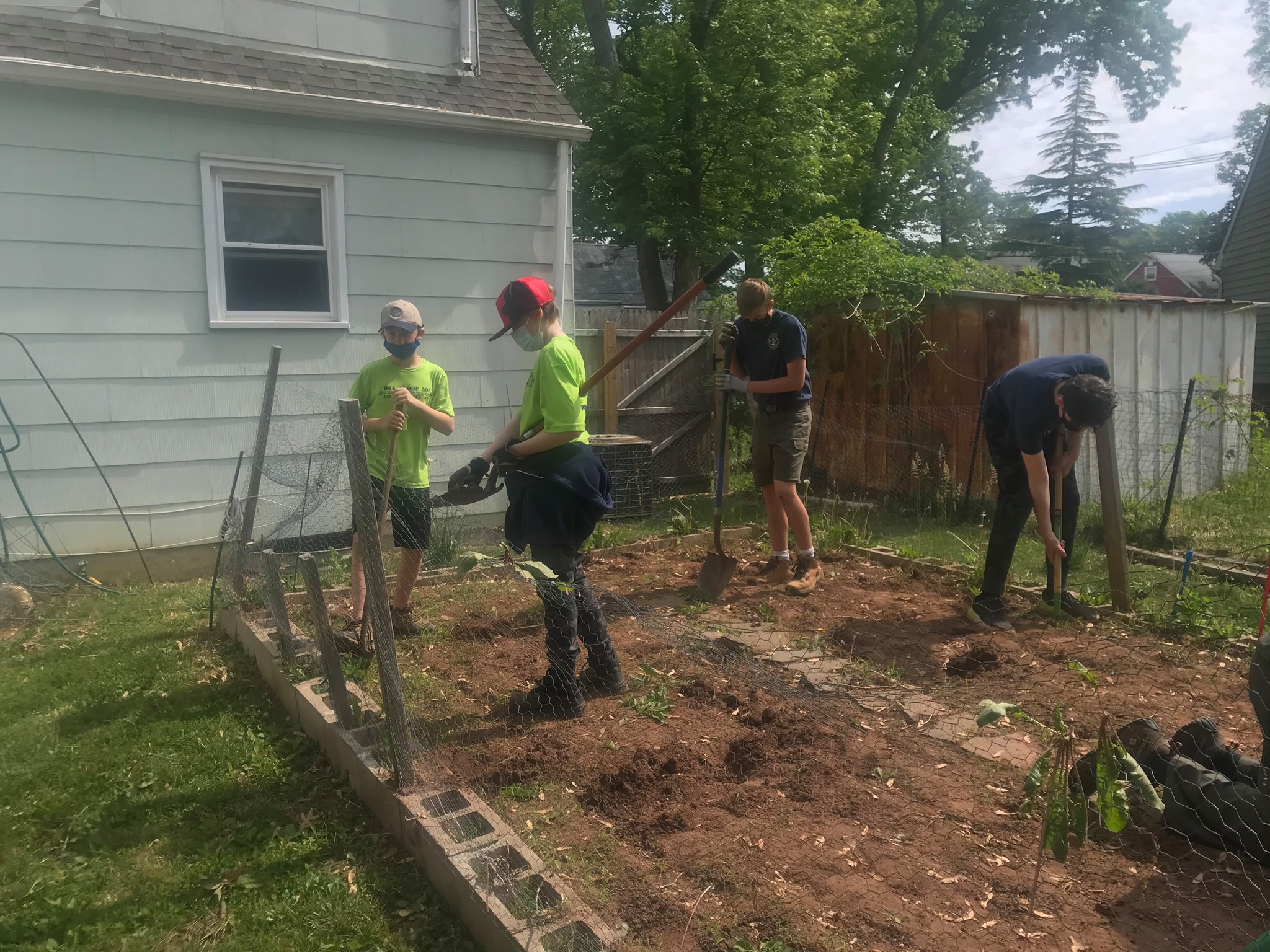 East Brunswick scouts help veteran plant garden