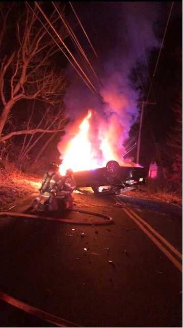 Monroe police officer pulls driver from car engulfed in flames