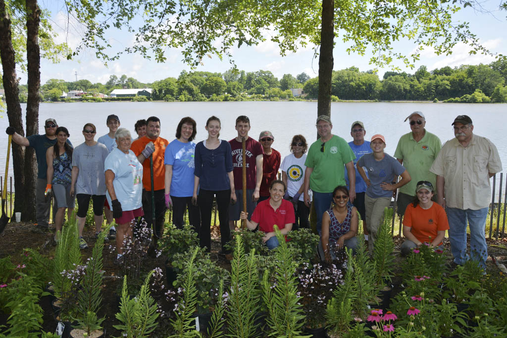 Volunteers take part in shoreline restoration at Manalapan Lake