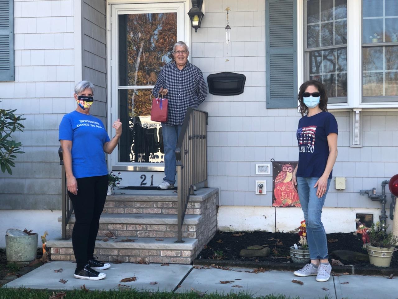 Spotswood Senior Center staff members deliver gift bags for Veterans Day