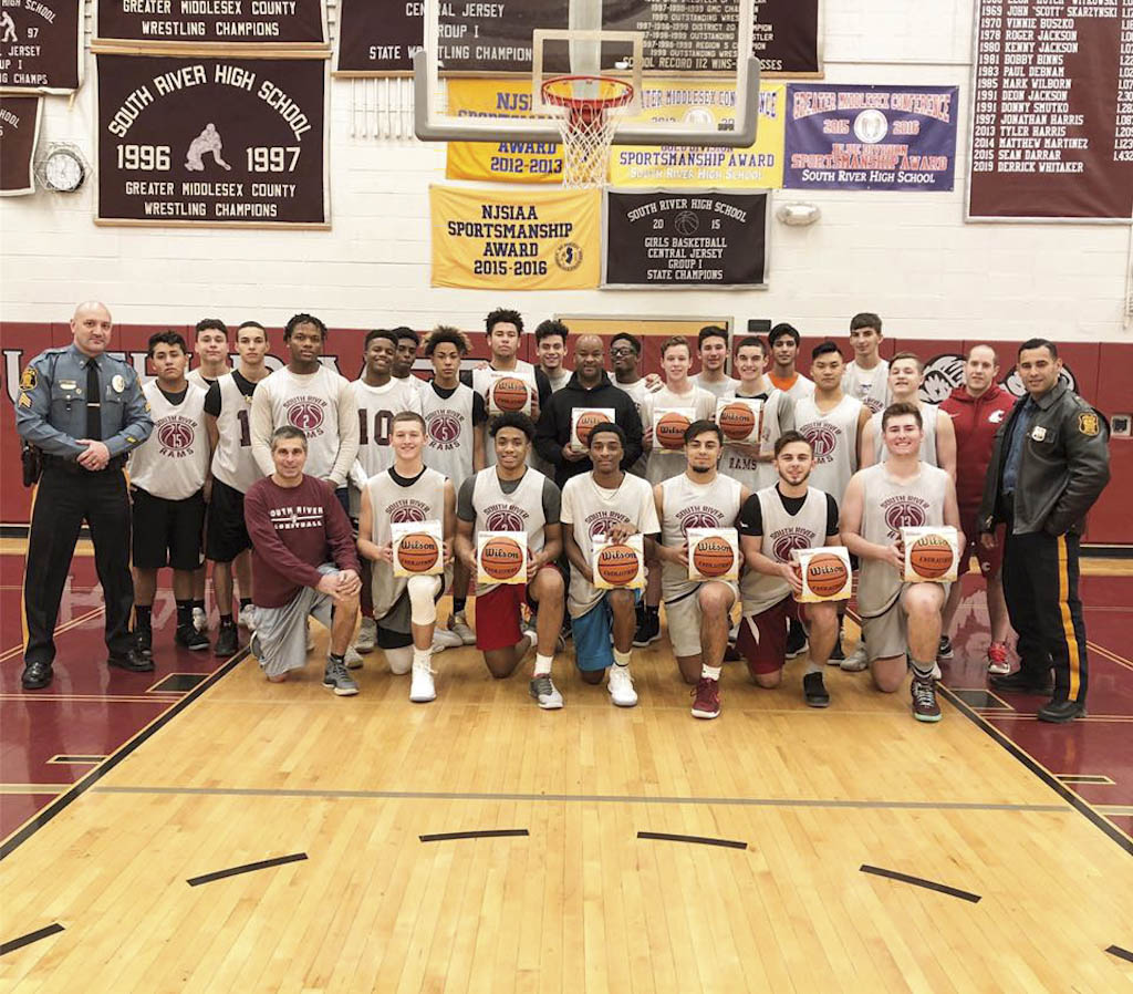 Police, municipal alliance donate basketballs to South River teams