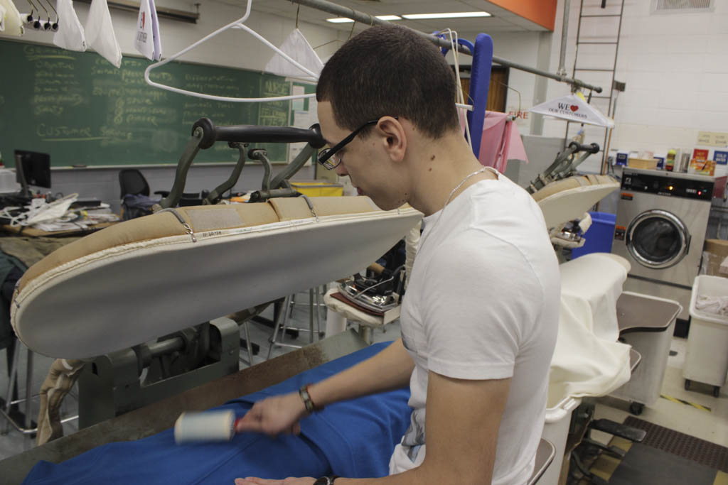 Vo-tech students prepare donated coats for the needy