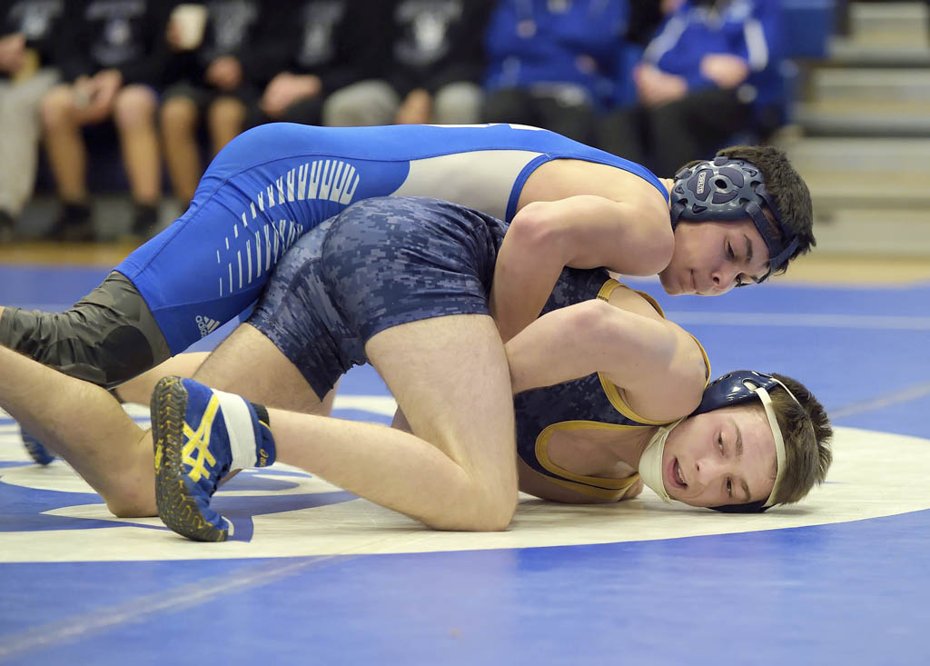 Green Wave, Spartans claim district wrestling championships