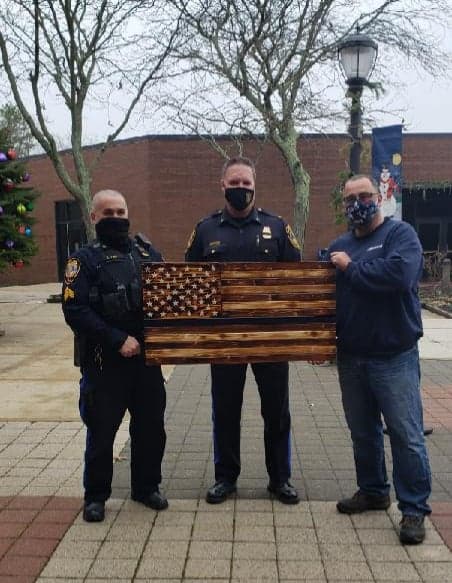 Old Bridge resident presents police with Thin Blue Line flag