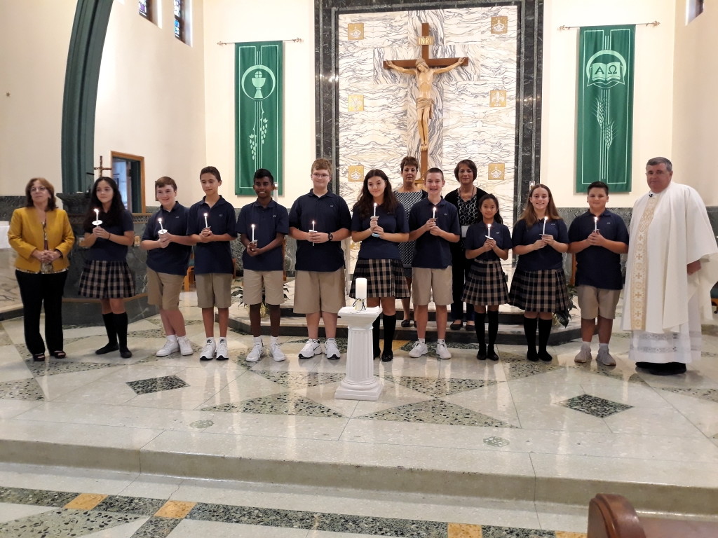 Eighth grade leaders of Our Lady of Victories School attend opening year Mass