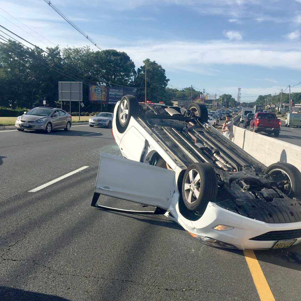 Rollover motor vehicle crash snarls traffic on Route 9