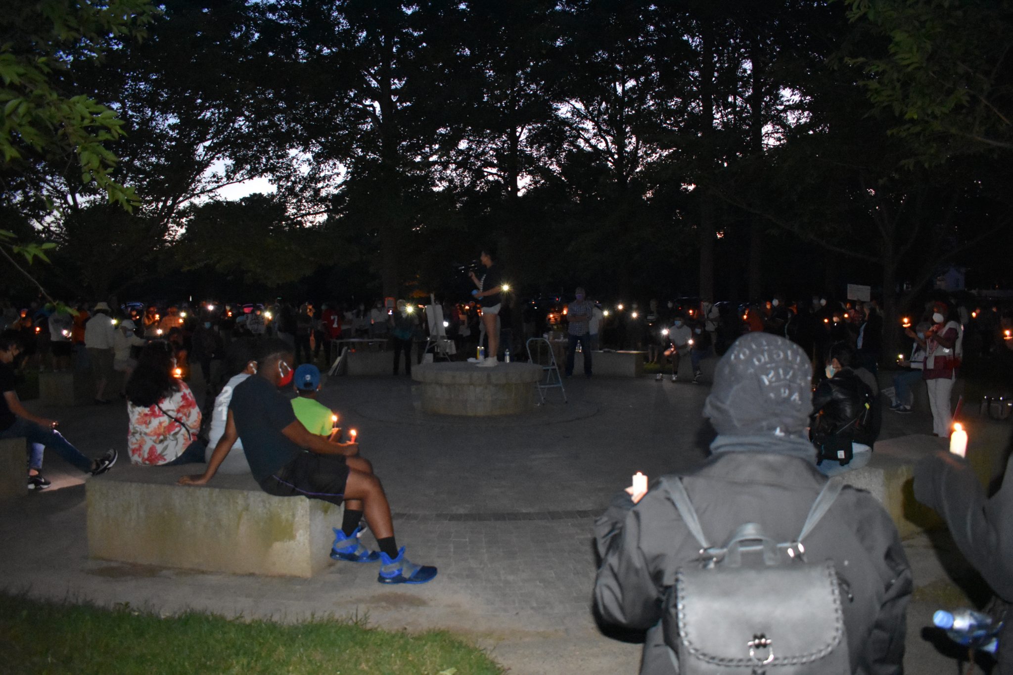 High school student draws crowd for candlelight vigil in memory of George Floyd